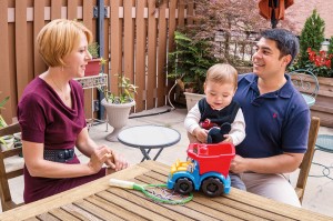 Erik Haass (right) at home in Chicago with his wife, Rebecca, and their son, Robert. (Photo by Lloyd DeGrane)