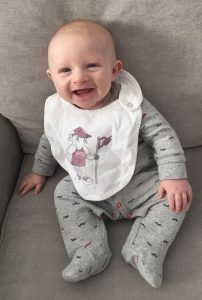 The Corrigans' son, Nino, three months old and already sporting Fordham gear.