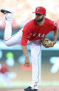 Nick Martinez has been with the Texas Rangers since 2001. Top: In June 2015, he met fellow Fordham alumnus Vin Scully, FCRH '49, in the broadcast booth at Dodger Stadium. Photos by Kelly Gavin/Texas Rangers