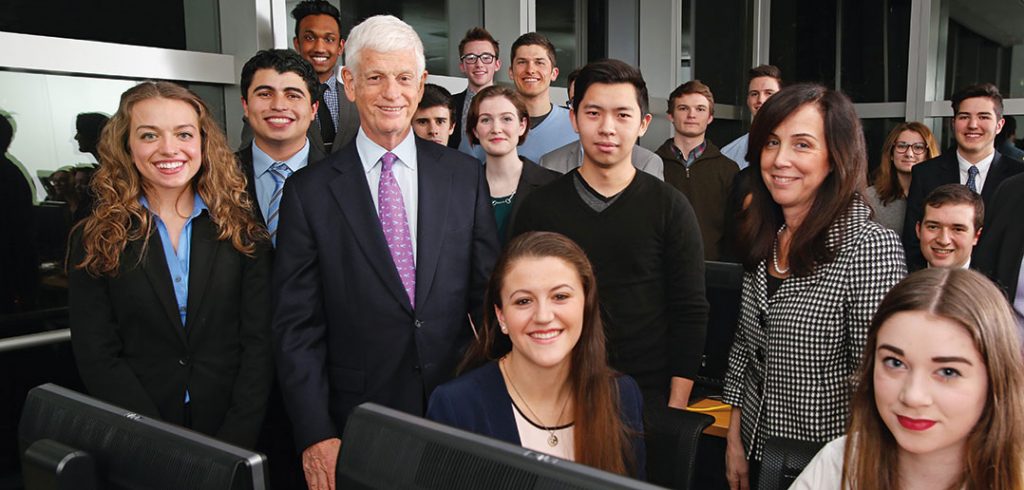 1965 Fordham graduate Mario Gabelli with students in February 2015