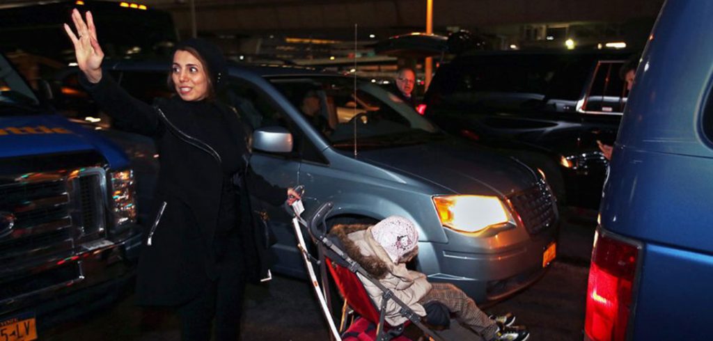 Fahimeh (Farimah) Kashkooli waves goodbye as she and Alma leave the airport.