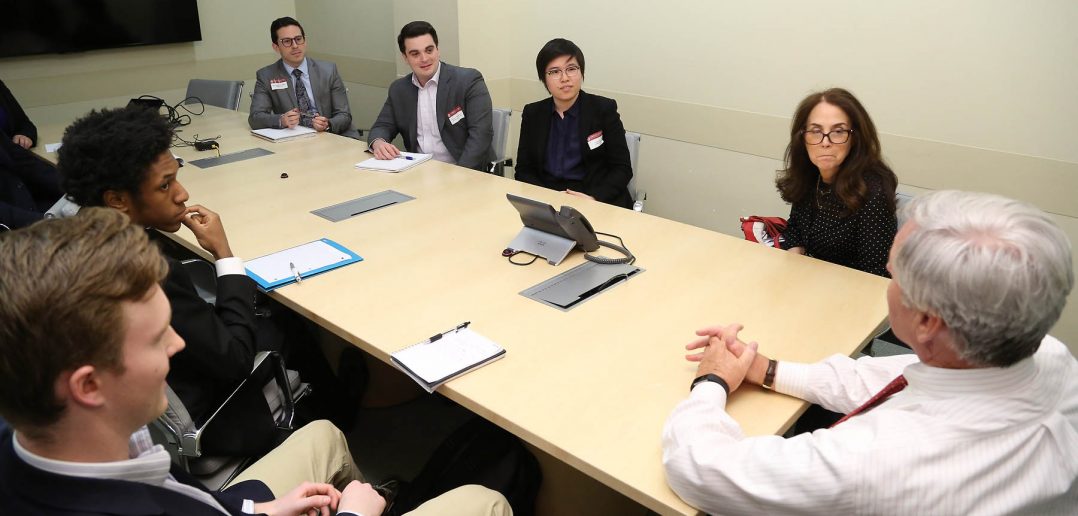  Brian C. Rogers, non-executive chairman of T. Rowe Price, meets with students from the Gabelli School of Business before delivering a talk on his 37-year career in investment management. 