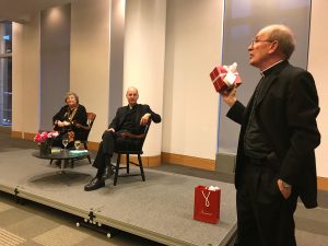 Joseph M. McShane, president of Fordham, presenting Elizabeth Johnson with a Baccarat Ram statue, as a token of the University's appreciation.