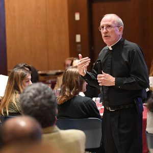 Father McShane greets guests