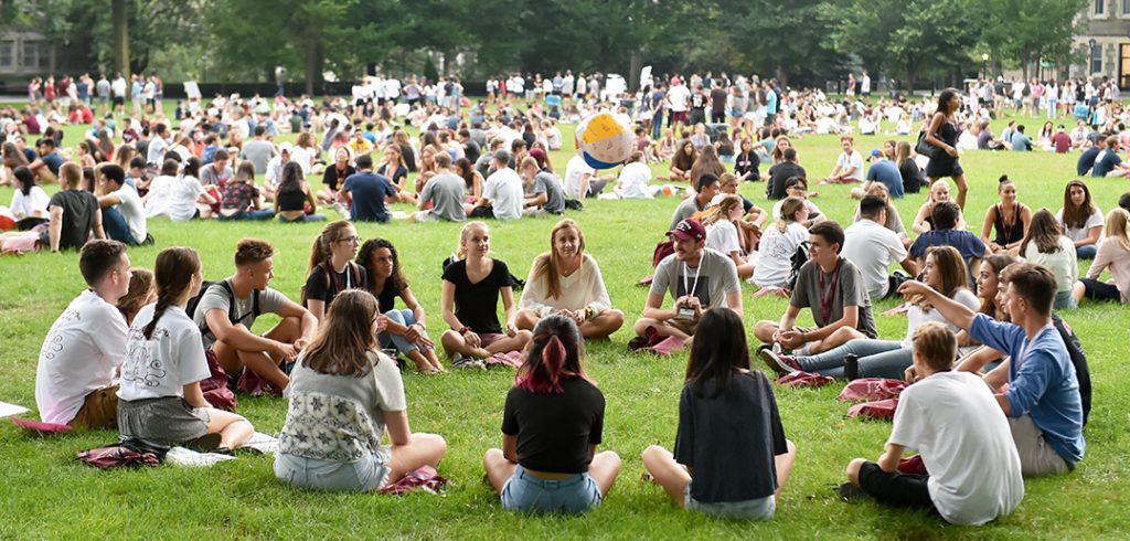 Students seated in circles on Edwards Parade