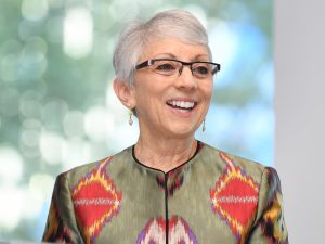 Harriet Edelman, GABELLI '80, Vice Chair of Emigrant Bank smiles at the podium 