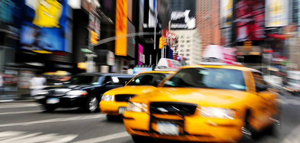 New York City taxi drives through Times Square