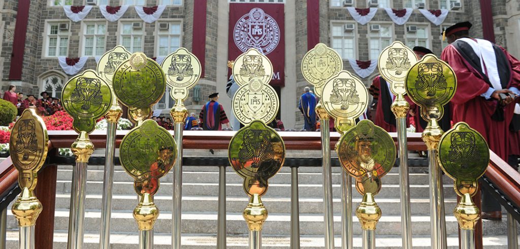 Miters representing all the colleges sit in stands on the steps of Keating Terrace