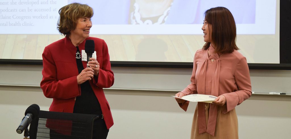 Elaine Congress and Yingying Zhu standing in front of a classroom at Fordham Law School