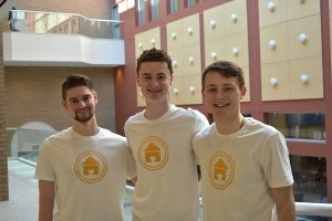 Joseph Zoyhofski, Liam Scott and Alex TenBarge, creators of What’s Cooking, standing together inside the atrium at the Lincoln Center campus