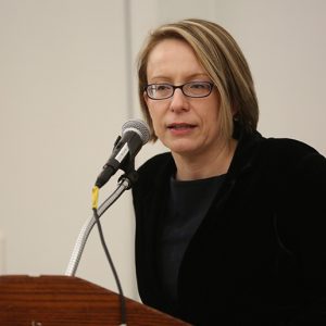 Eva Badowska welcomes faculty to the dinner.