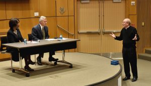 Joseph M McShane, President of Fordham, addresses Anita Allen at McNally Amiptheatre.