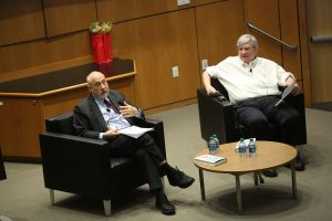 Joseph Stiglitz and Bruce Greenwald sitting on stage at the McNally Amphitheatre