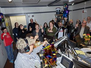 Colleagues toasting Houston at her 25th anniversary celebration