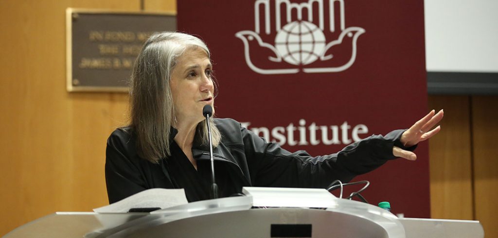 Amy Goodman speaks from the podium at McNally Amphitheatre