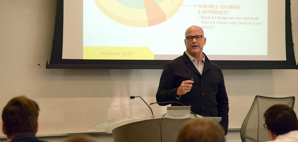 Jerry White standing in front of a classroom