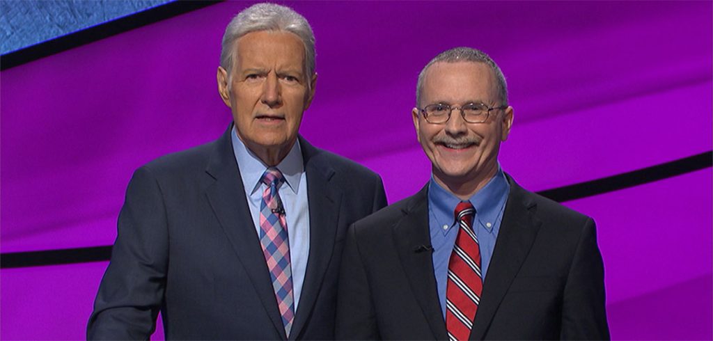 Host of Jeopardy Alex Trebek poses with Ed Condon, FCRH'84.