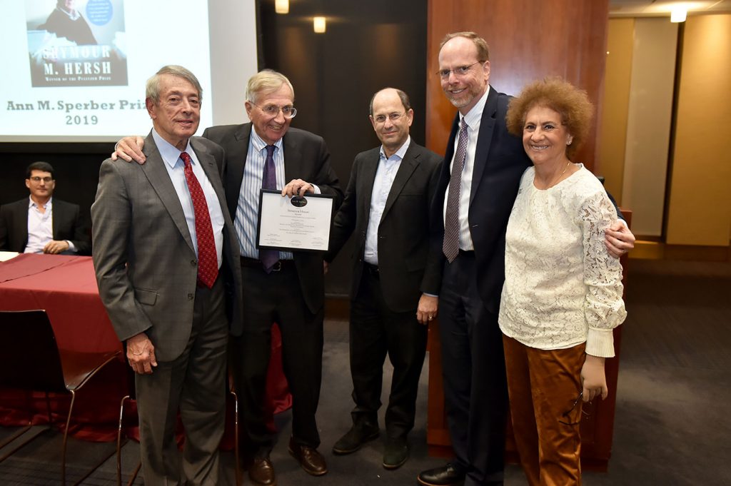 Seymour Hersh poses for a picture with the Sperber family and members of the Fordham faculty.