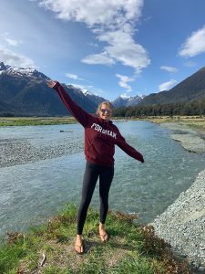 woman standing in front of a lake