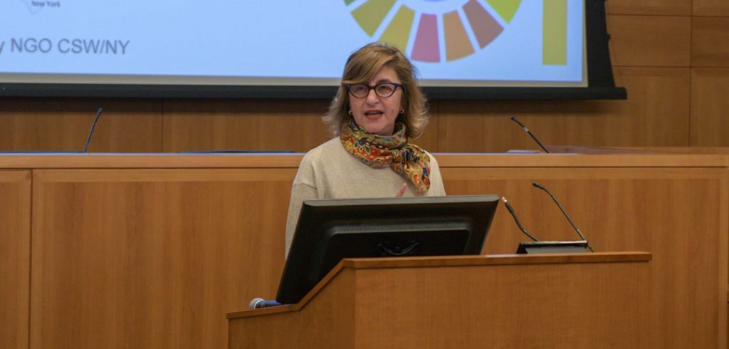 A woman talks at a podium