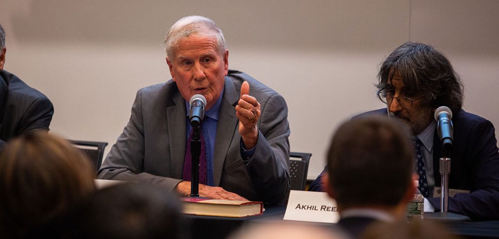 John D. Feerick sitting at a table