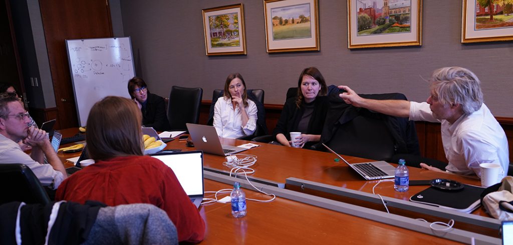 Vincent-Antonin Lépinay gestures at conference table.