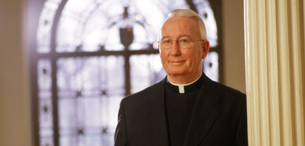 Joseph A. O'Hare, S.J., president of Fordham University, standing in Cunniffe House, circa 2002