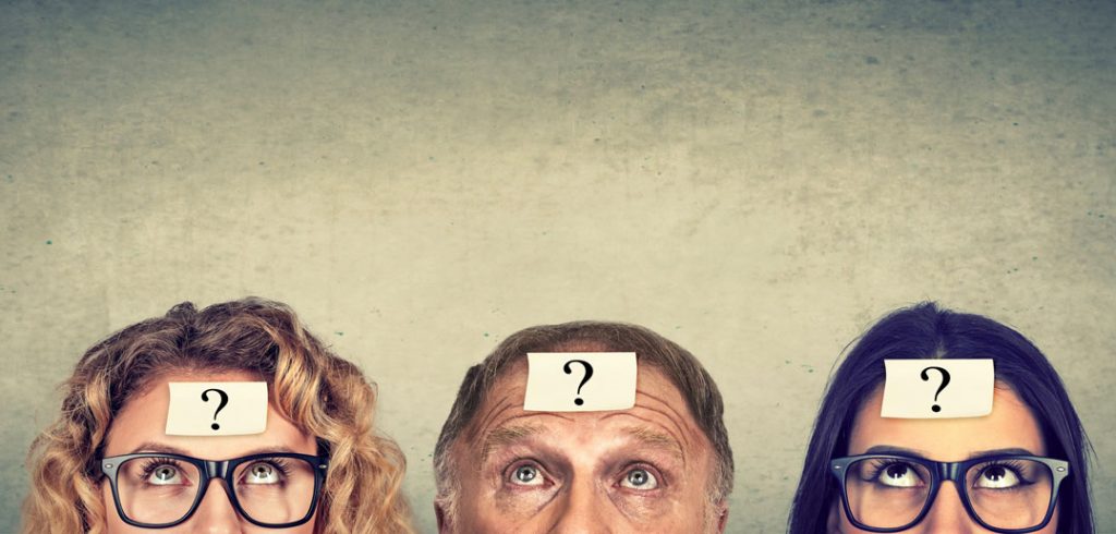 Three people's heads with question marks on their foreheads