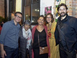 Two men and three women smile for a group photo.