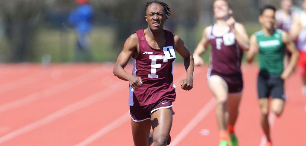 A man runs track