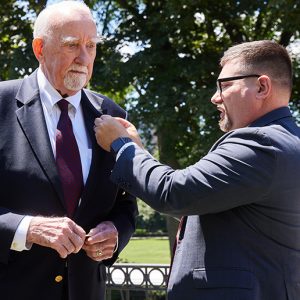 Lenehan recieves Ram Veteran Lapel Pin from Matt Butler