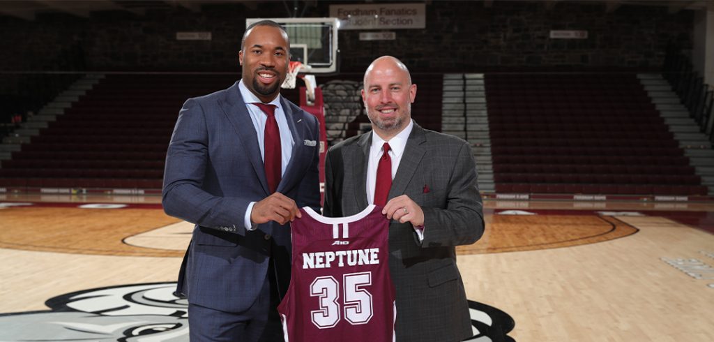 Athletic director Ed Kull, right, posing with new men's head basketball coach Kyle Neptune.