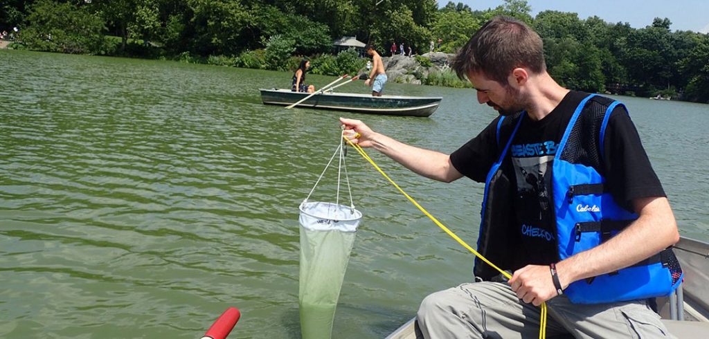 Michael Kautsch sampling water from the Central Park Lake