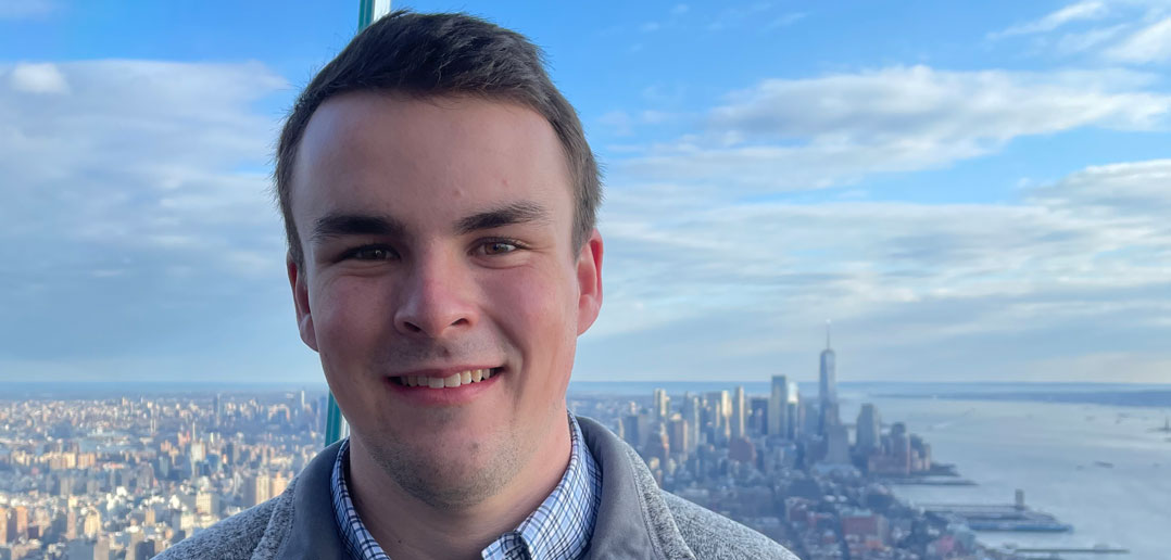 A student in front of New York City