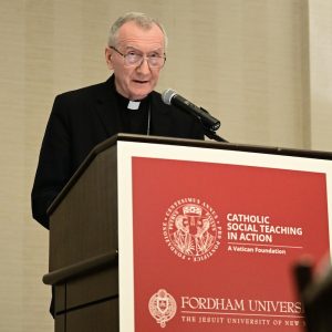 A man speaks at a podium.