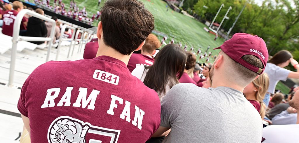 Two men watch football