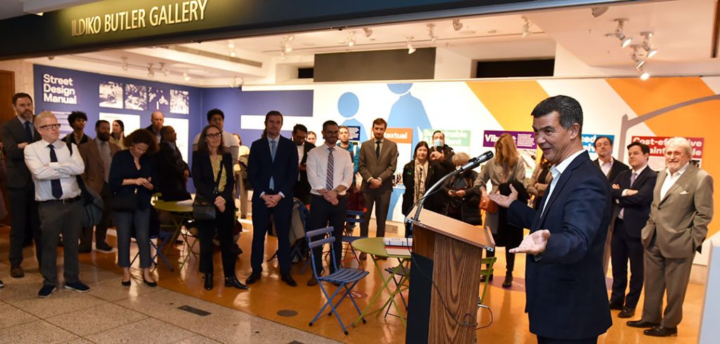 NYC DOT Commissioner Ydanis Rodriguez addresses a group of people from a podium