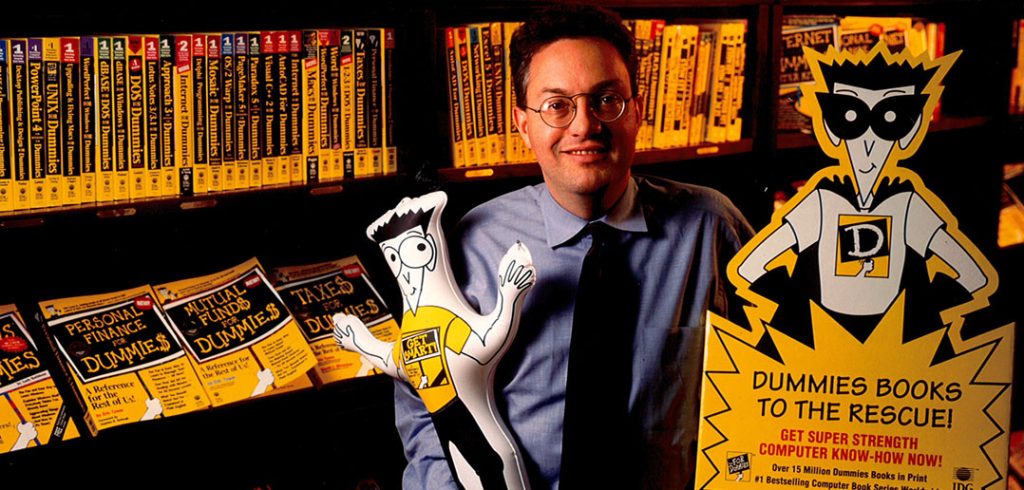 Fordham graduate John Kilcullen, circa 1995, with a display of copies of books in the "For Dummies" series he created