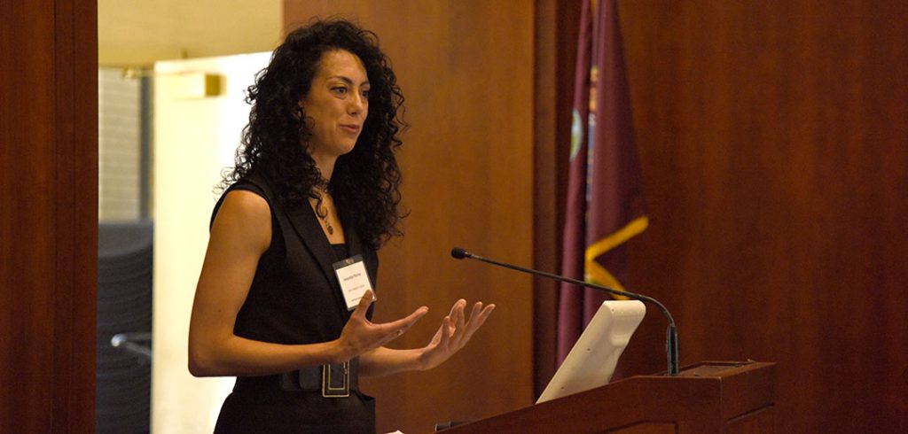 Jacquelyn Pavlion standing at a lectern