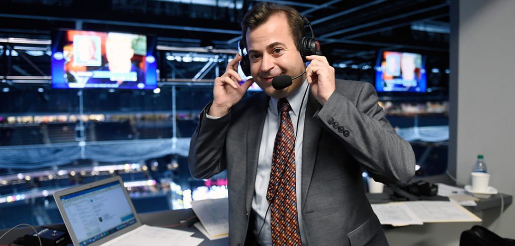 A man broadcasting hockey