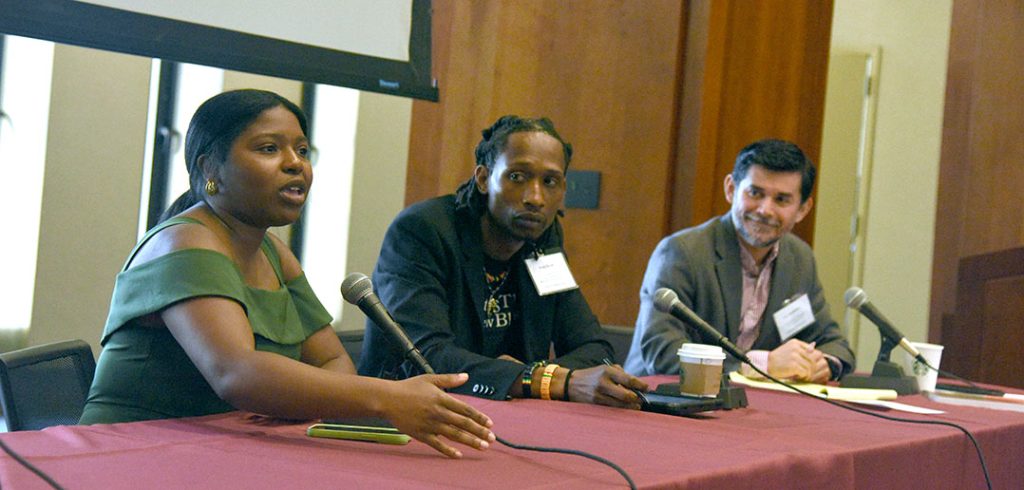 Dejia Marie James, Isaac Scott, and Leo Guadardo seated at a table