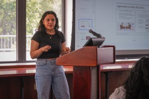 Student presenting at a podium.