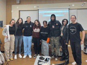 Students standing in a row in a classroom