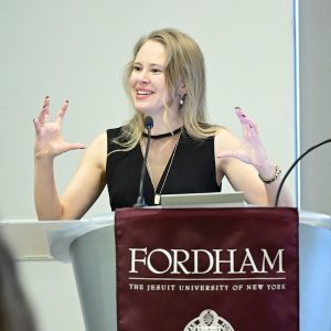 Julie Gafney speaks at a podium.