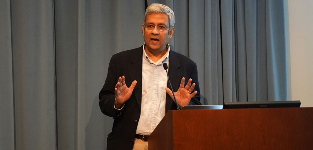 J. R. Rao speaking at a podium