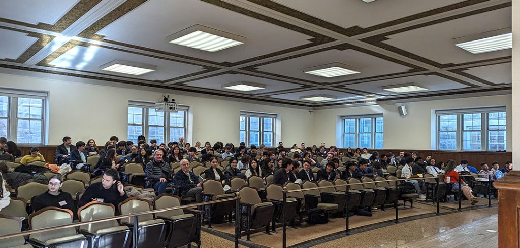 Large group of students seated in an auditorium