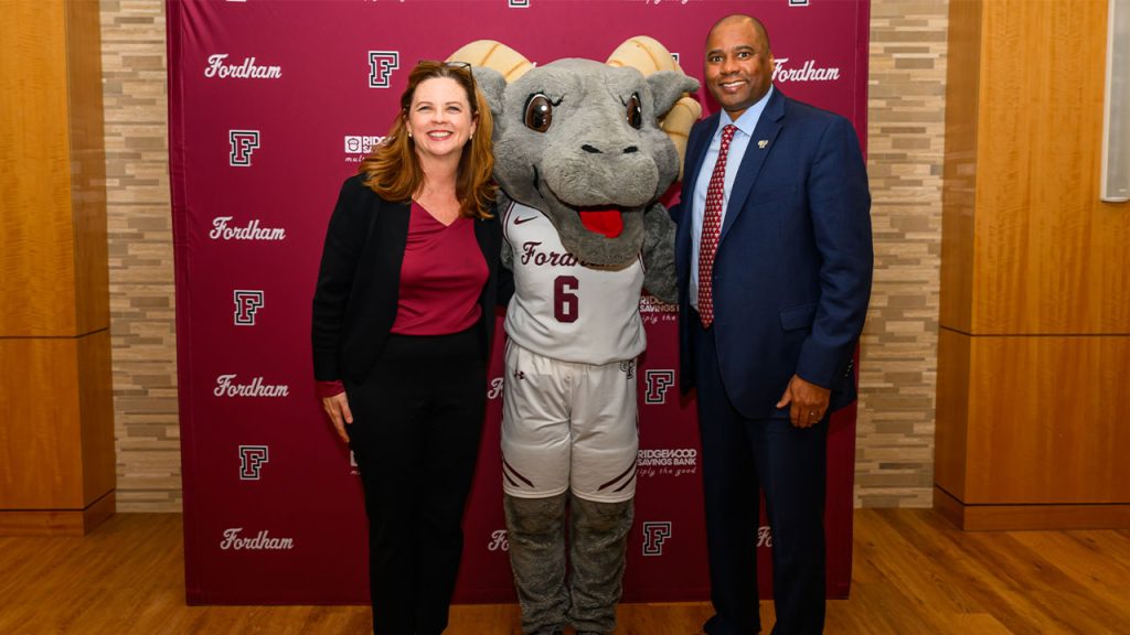 Charles Guthrie, right, with Fordham President Tania Tetlow and Ramses.