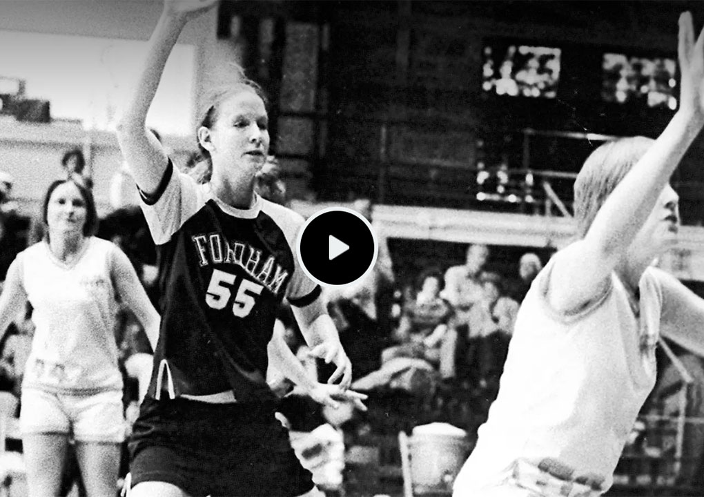 Black and white still from video of women's basketball player